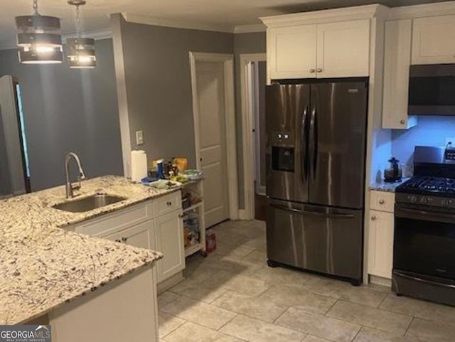 kitchen featuring gas range oven, sink, fridge with ice dispenser, and crown molding