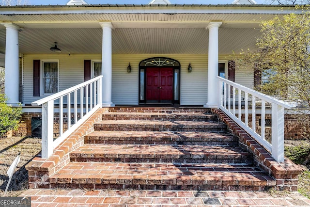 property entrance with covered porch