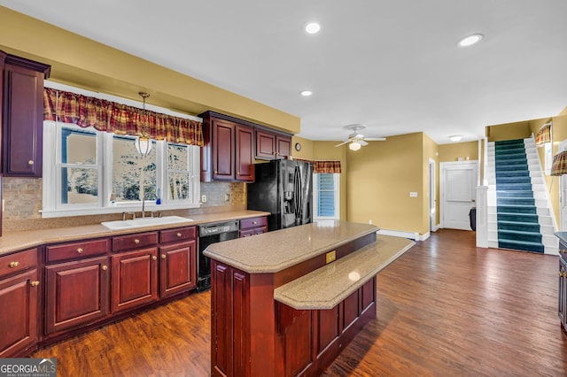 kitchen with stainless steel fridge with ice dispenser, black dishwasher, tasteful backsplash, and a center island