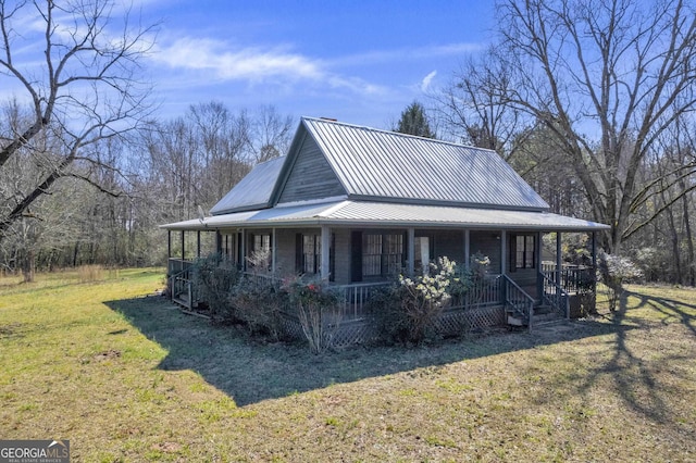 exterior space with a yard and covered porch