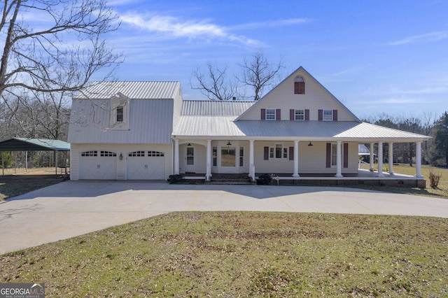 view of front facade with a front lawn, covered porch, and a garage