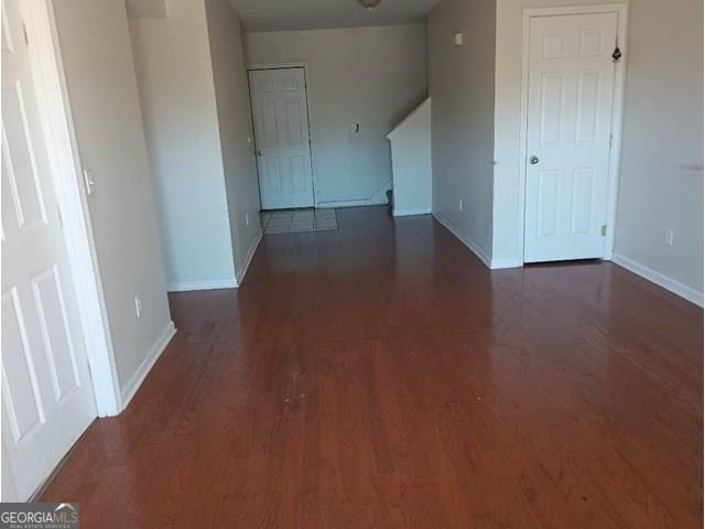 unfurnished room featuring dark hardwood / wood-style floors