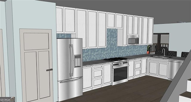 kitchen featuring stainless steel appliances, white cabinets, tasteful backsplash, and sink