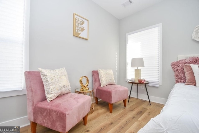 sitting room with light hardwood / wood-style floors