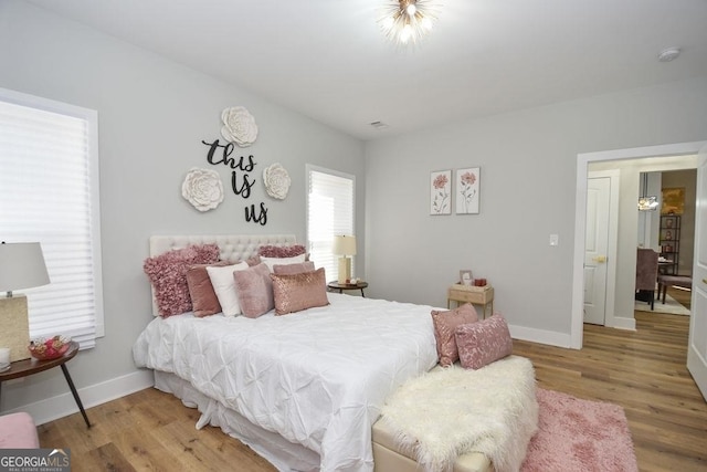 bedroom with light hardwood / wood-style floors