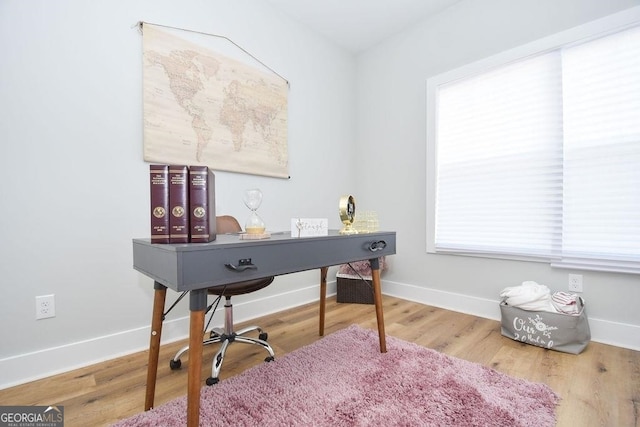 home office featuring light hardwood / wood-style floors