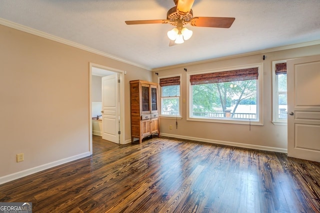228 Harris Rd, Jackson, GA 30233 - interior space with ceiling fan, dark hardwood / wood-style floors, and crown molding