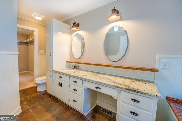228 Harris Rd, Jackson, GA 30233 - bathroom with tile floors, crown molding, toilet, and vanity