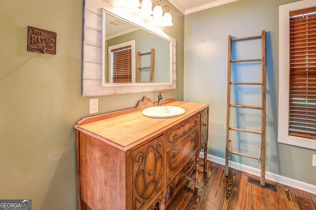 228 Harris Rd, Jackson, GA 30233 - bathroom with wood-type flooring, crown molding, and large vanity