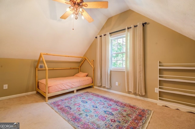 228 Harris Rd, Jackson, GA 30233 - carpeted bedroom featuring vaulted ceiling, ceiling fan, and a textured ceiling