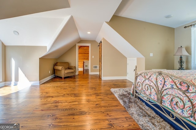 228 Harris Rd, Jackson, GA 30233 - bedroom with hardwood / wood-style floors and lofted ceiling