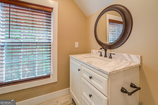 228 Harris Rd, Jackson, GA 30233 - bathroom with oversized vanity, hardwood / wood-style flooring, and lofted ceiling