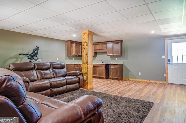 228 Harris Rd, Jackson, GA 30233 - living room with a paneled ceiling, sink, and light wood-type flooring