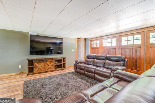 228 Harris Rd, Jackson, GA 30233 - living room featuring hardwood / wood-style flooring and a drop ceiling