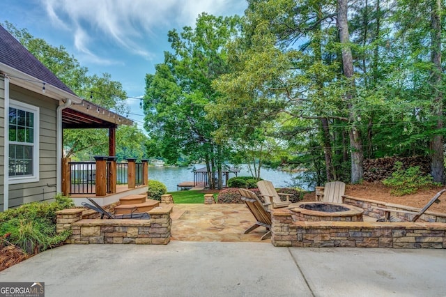 228 Harris Rd, Jackson, GA 30233 - view of terrace with an outdoor fire pit and a deck with water view