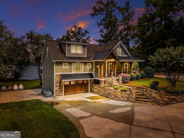 228 Harris Rd, Jackson, GA 30233 - craftsman house with central AC, a garage, covered porch, and a lawn