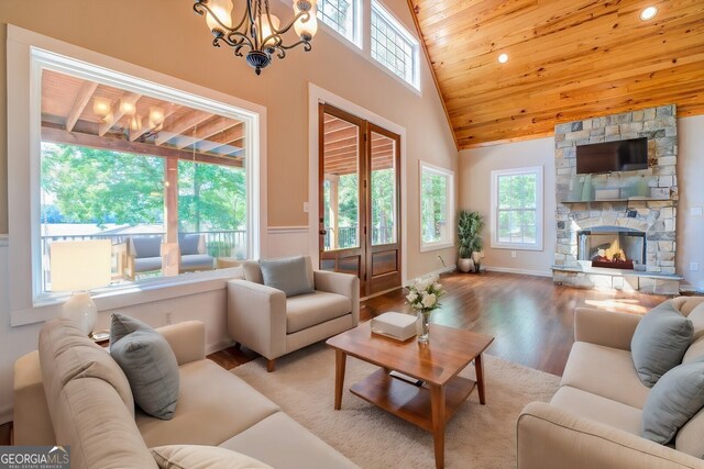 228 Harris Rd, Jackson, GA 30233 - living room with a fireplace, a chandelier, hardwood / wood-style floors, high vaulted ceiling, and wood ceiling