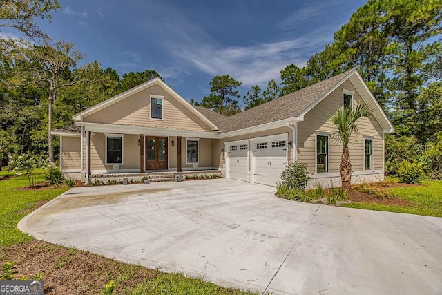 view of front of house with a porch and a garage