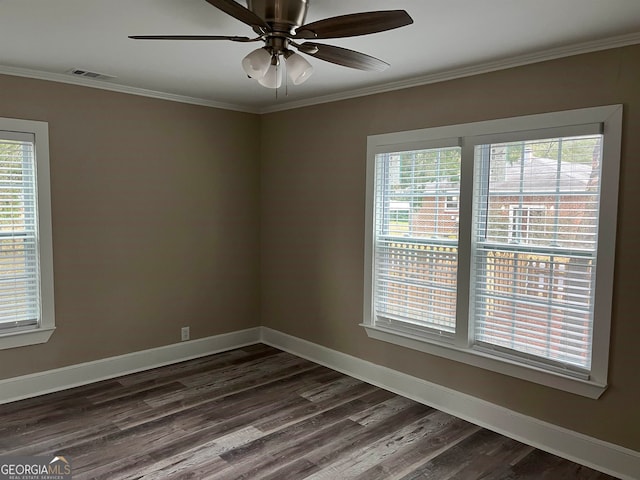 unfurnished room with crown molding, ceiling fan, and dark hardwood / wood-style flooring