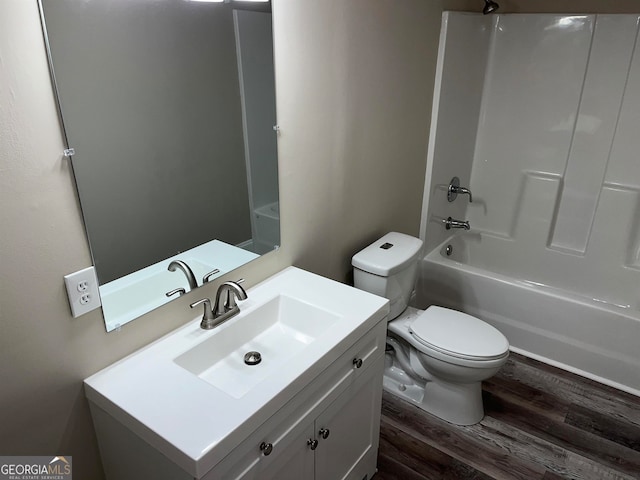 full bathroom featuring vanity, wood-type flooring, toilet, and tub / shower combination