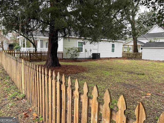 view of front facade with central AC and a front yard