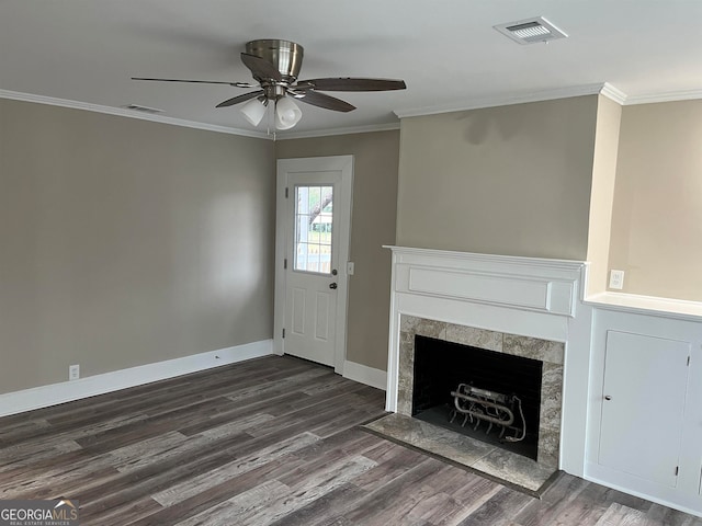 unfurnished living room featuring dark wood-type flooring, crown molding, and ceiling fan