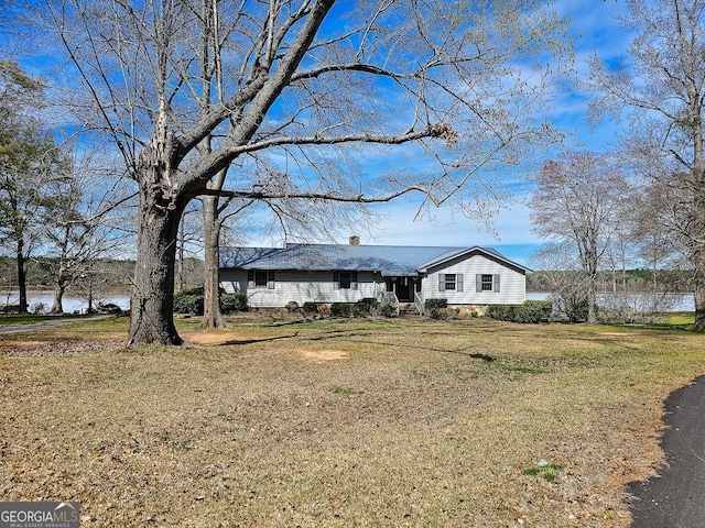 exterior space with a front lawn