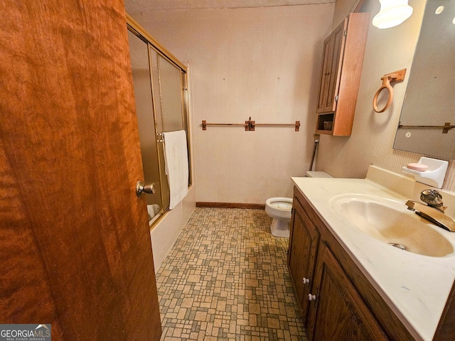 bathroom with vanity, tile floors, and toilet