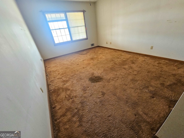 view of carpeted spare room