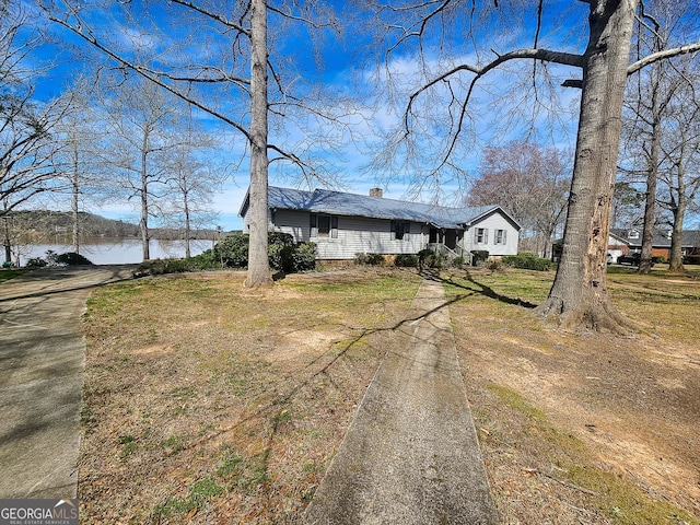 ranch-style home featuring a water view