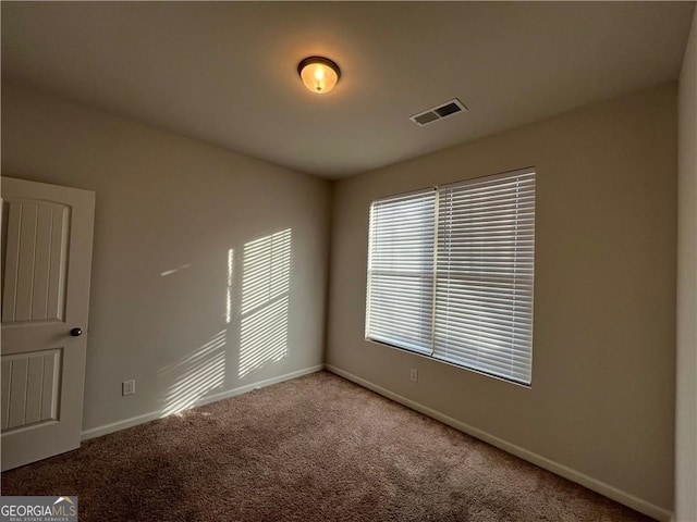 unfurnished room featuring carpet floors