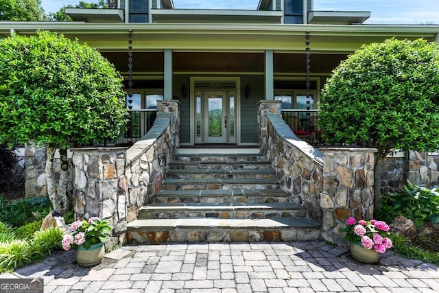 doorway to property featuring a porch