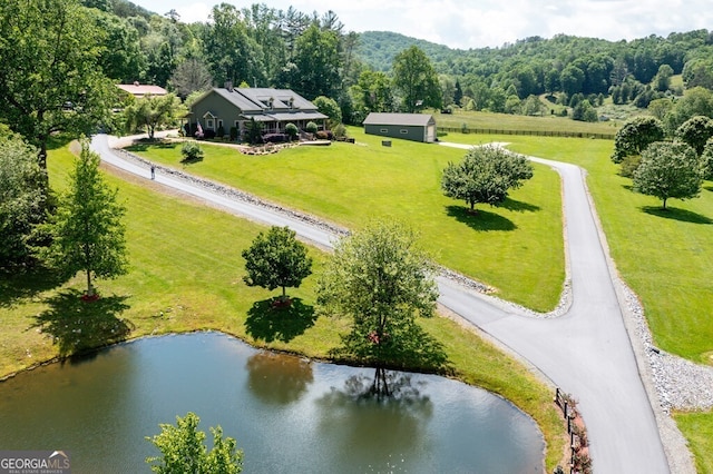 aerial view with a water view and a rural view