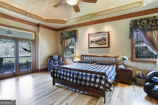 bedroom featuring light wood-type flooring, ornamental molding, access to exterior, and ceiling fan