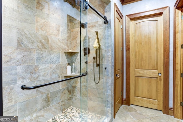 bathroom featuring a shower with door