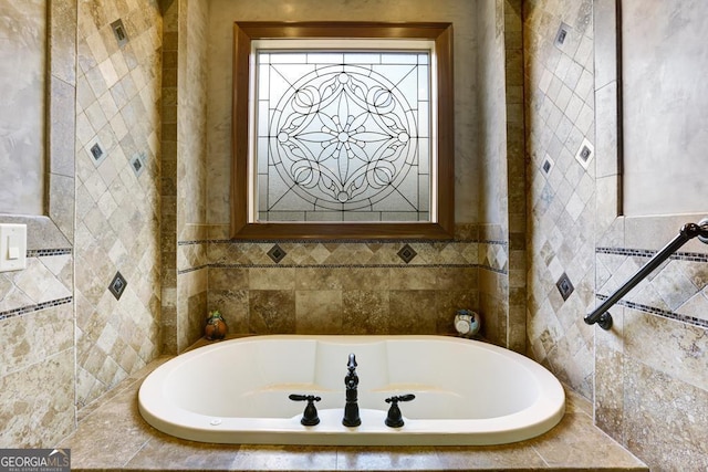 bathroom featuring tiled tub