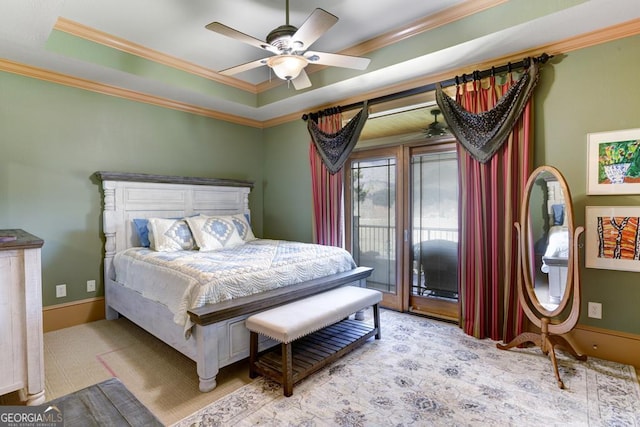 carpeted bedroom featuring crown molding, a raised ceiling, access to outside, and ceiling fan