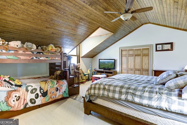 carpeted bedroom with wooden ceiling, vaulted ceiling, and ceiling fan