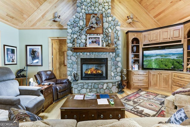 living room with crown molding, wood ceiling, light hardwood / wood-style floors, a stone fireplace, and high vaulted ceiling