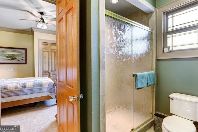 bathroom featuring an enclosed shower, ceiling fan, toilet, and crown molding