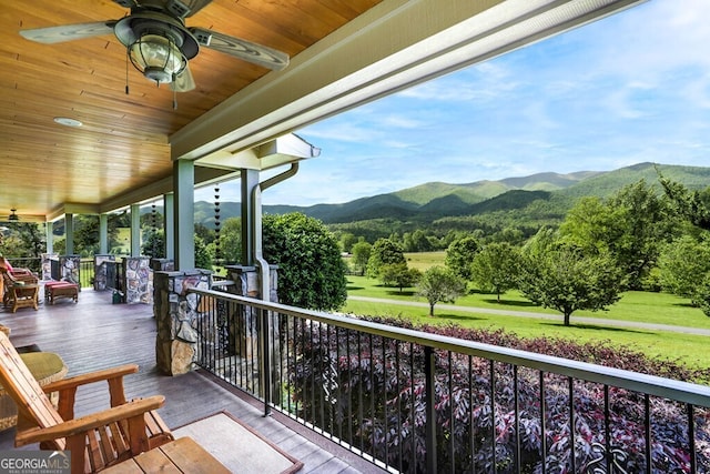 balcony with ceiling fan and a mountain view