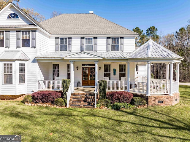 view of front of house featuring a front yard and covered porch