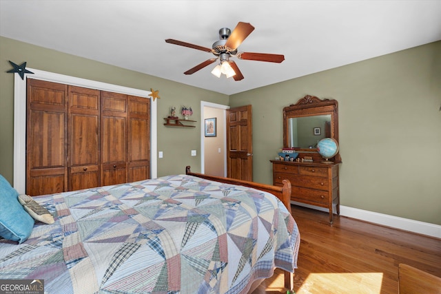 bedroom featuring a closet, ceiling fan, and hardwood / wood-style flooring