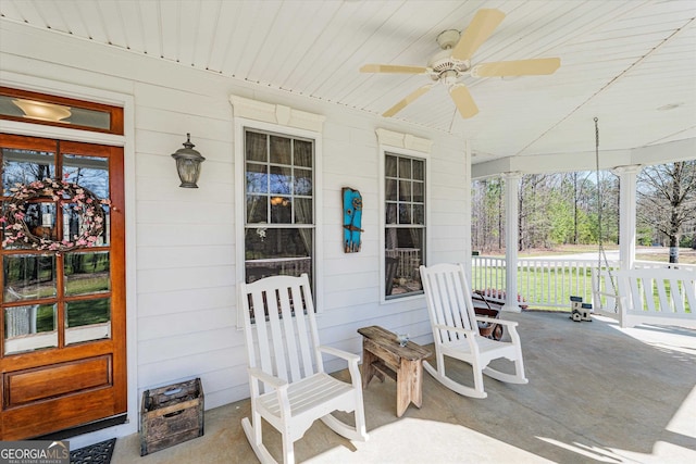 exterior space featuring ceiling fan