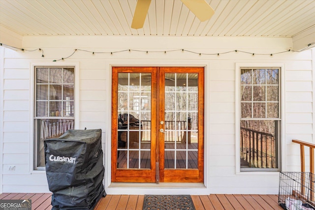 property entrance featuring french doors and ceiling fan