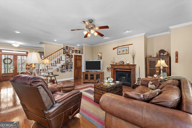 living room featuring ornamental molding, dark hardwood / wood-style floors, and ceiling fan