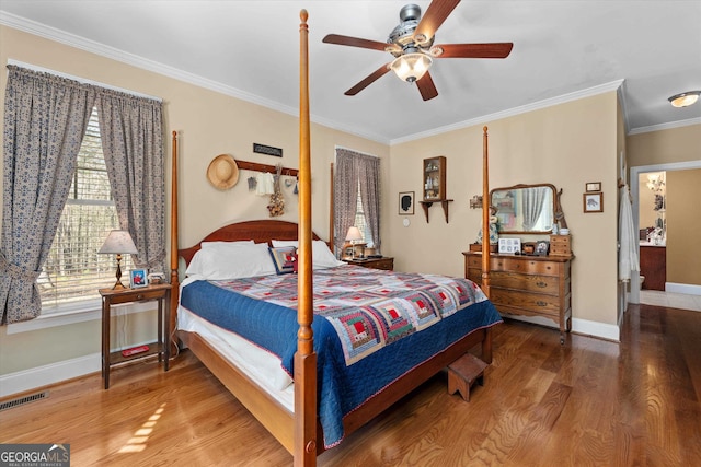 bedroom featuring ornamental molding, ceiling fan, and hardwood / wood-style flooring