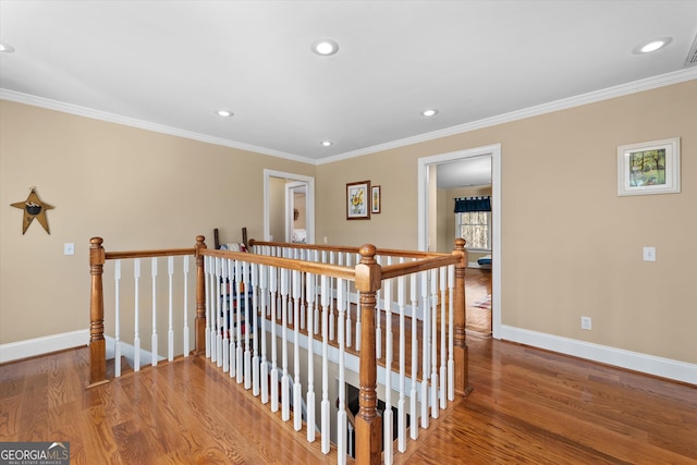 interior space with hardwood / wood-style floors and ornamental molding