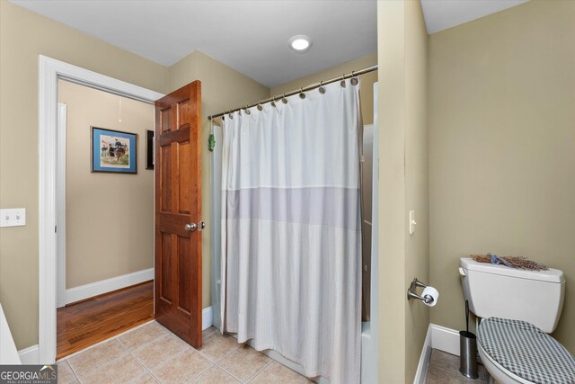 bathroom featuring toilet and hardwood / wood-style floors