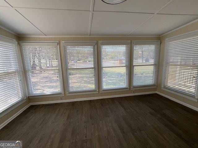 unfurnished sunroom featuring plenty of natural light